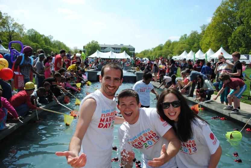 3 students in the ODK fountain on Maryland Day