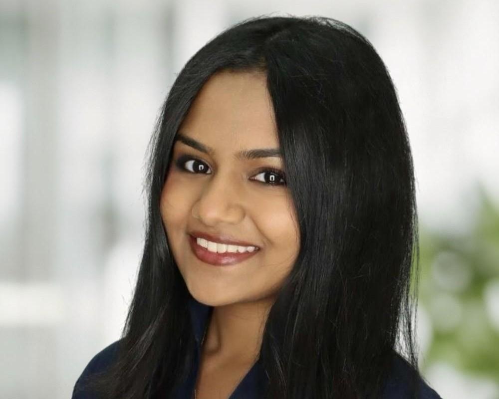 Harshita in front of white background