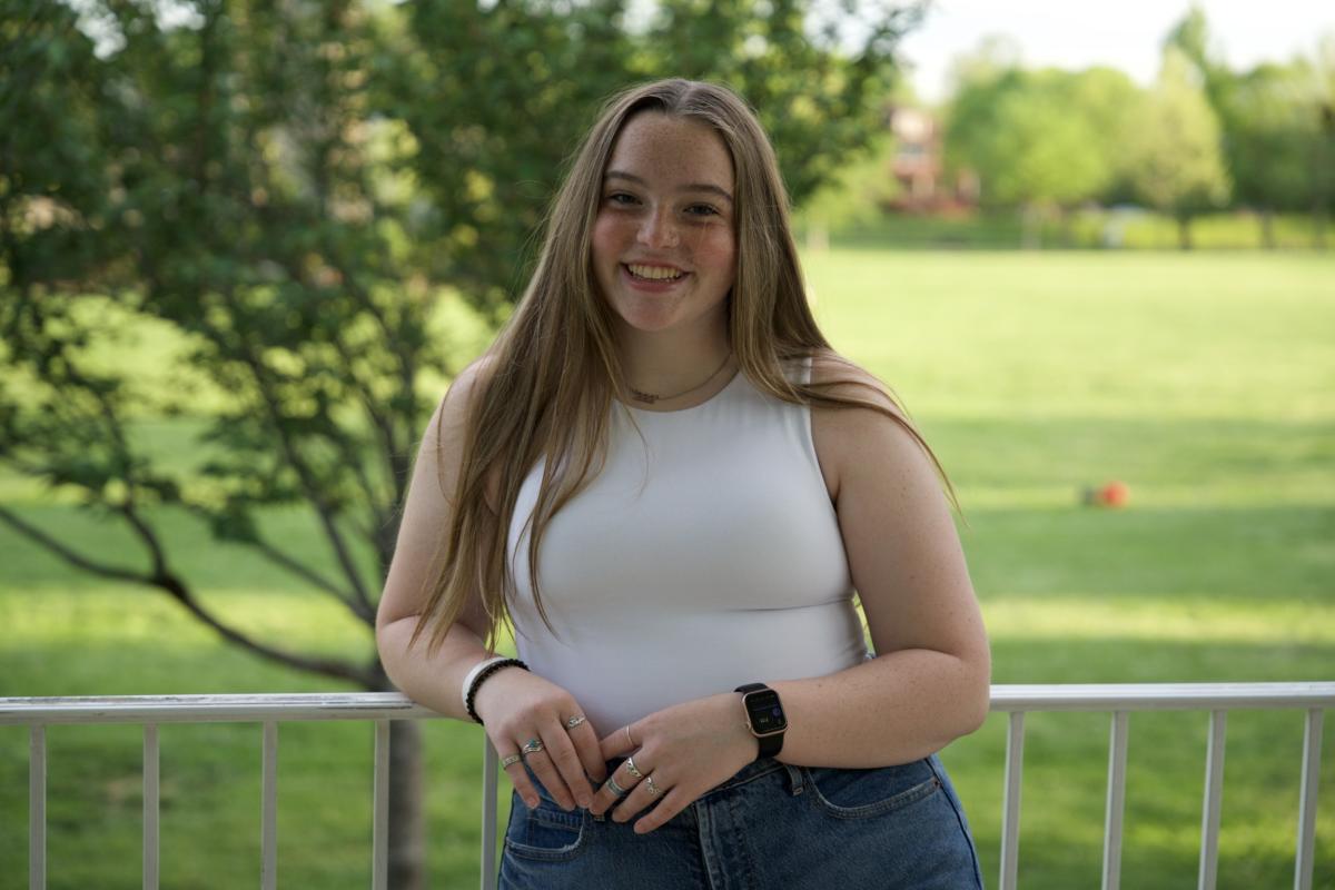 Emily in front of a green meadow
