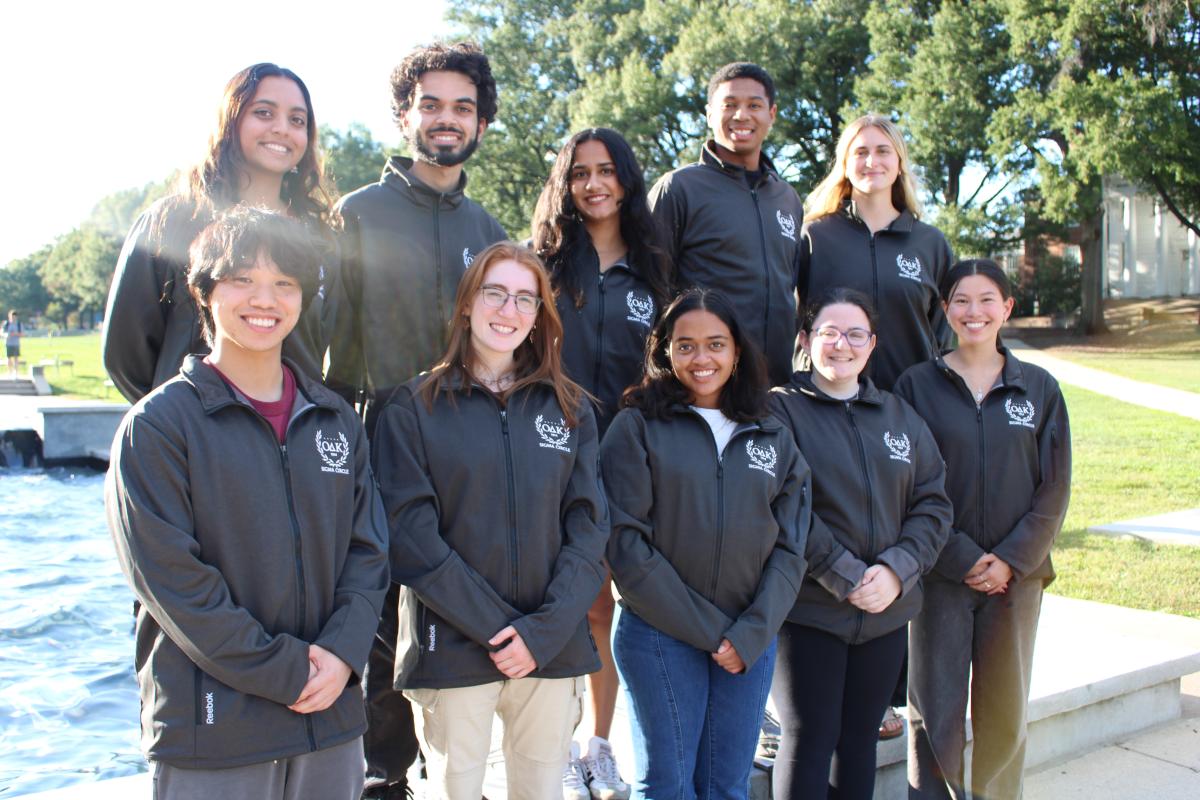 Photo of 10 executive members in front of the fountain wearing ODK jackets