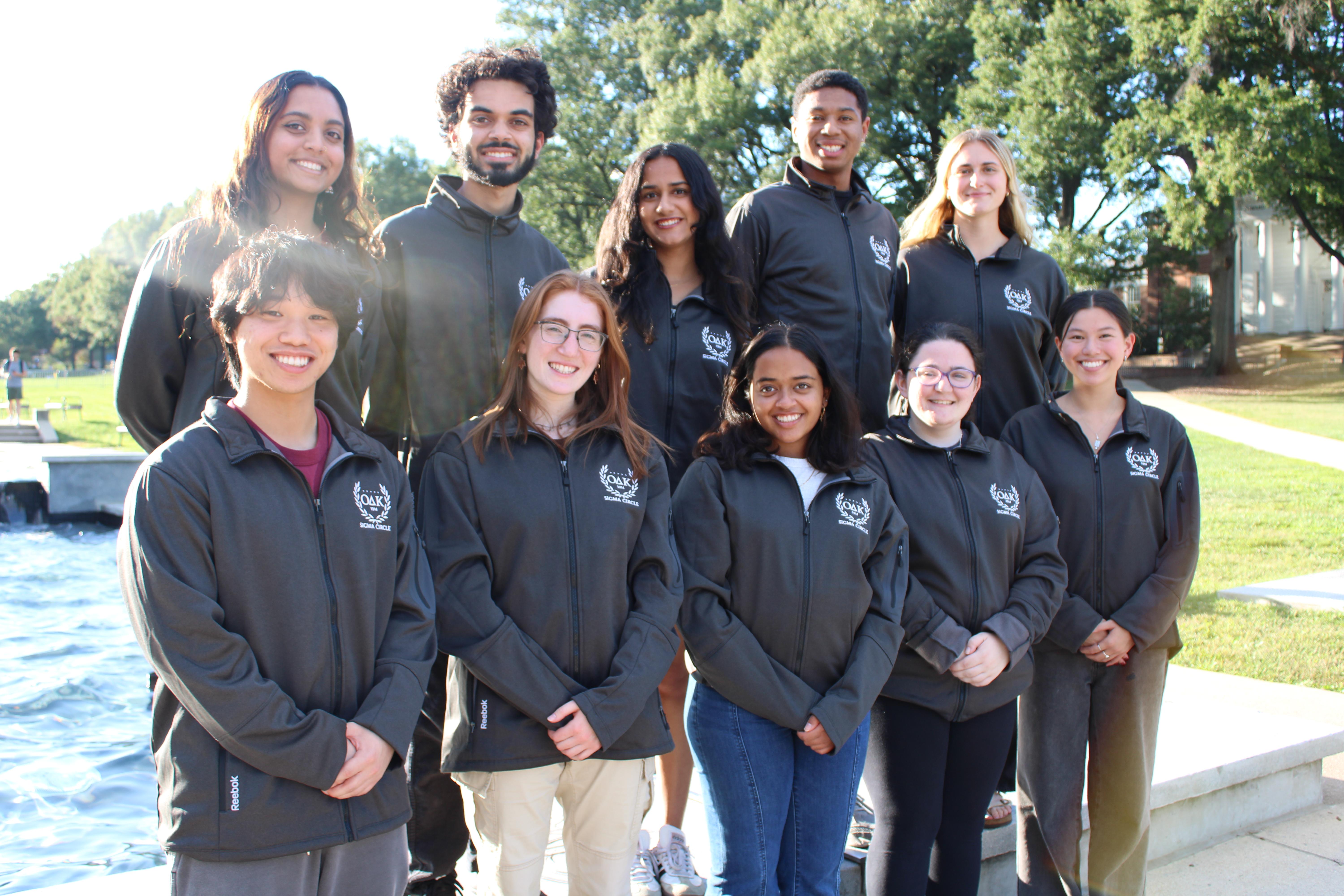 Photo of 10 executive members in front of the fountain wearing ODK jackets