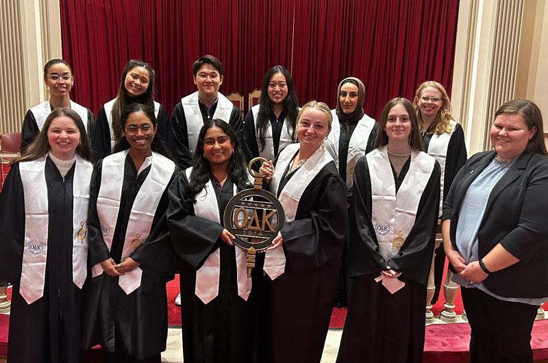 ODK Executive Board members dressed in black robes holding the ODK Key.